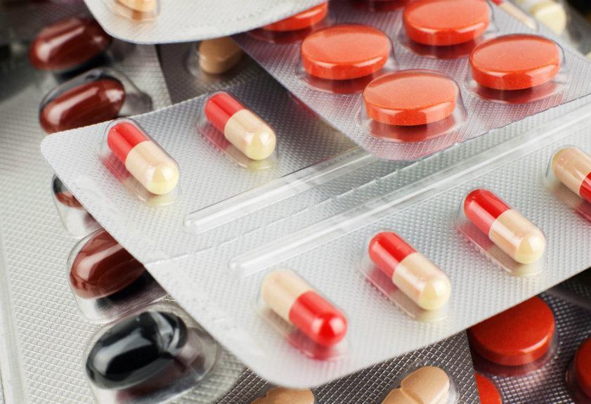 Blister packs of prescription antibiotics and pills associated with potential eye and vision side effects.