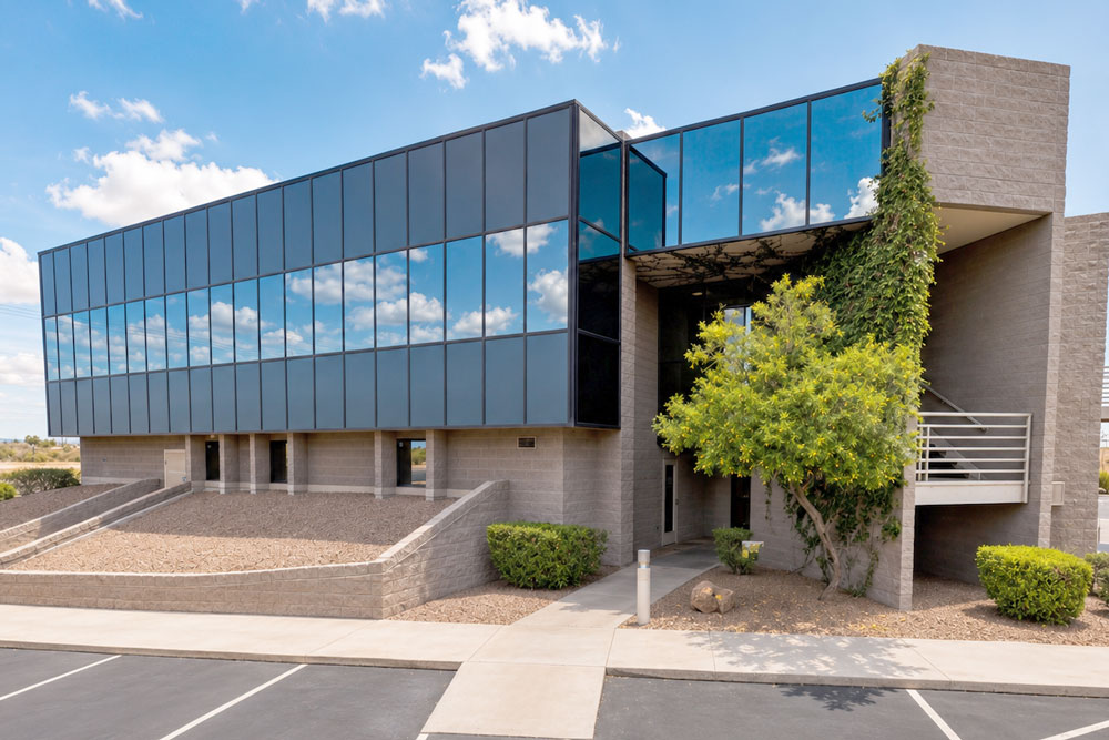 Exterior view of the Southwestern Eye Center Apache Junction location with modern glass windows, desert landscaping, and an accessible parking area.