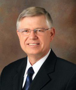Headshot of Dr. L. Lothaire Bluth, founder of Southwestern Eye Center and pioneer in integrated eye care.