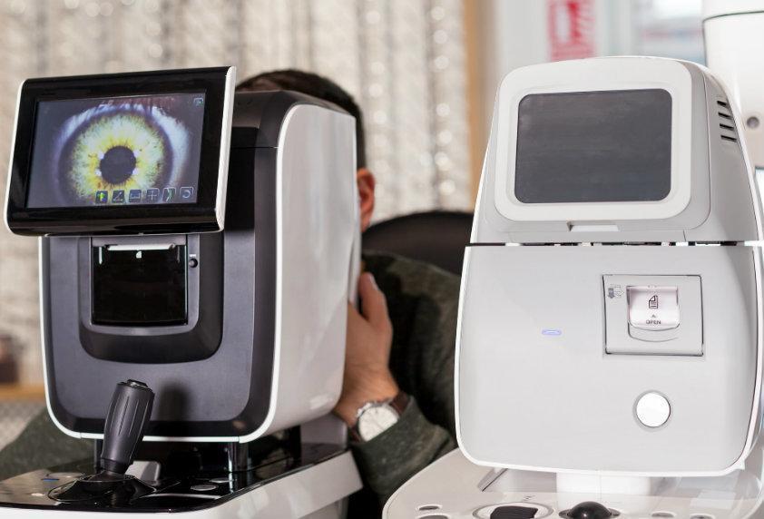 Eye exam using autorefractor and retinal imaging devices to measure vision and detect eye health issues, including signs of diabetes.