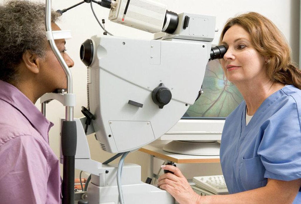 Nurse performing a comprehenive eye exam to clear up the misconceptions about glaucoma at Southwestern Eye Center.
