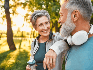 Active senior couple excercising again after astigmatism treatment at Southwestern Eye Center.