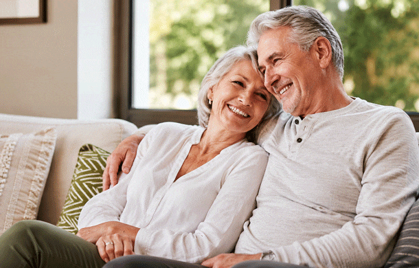 Senior couple relaxing at home after reviewing the cataract surgery costs from Southwestern Eye Center.