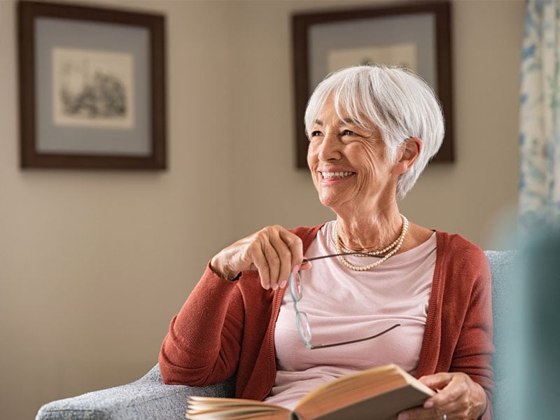 Imagery of a senior woman excited about her cataract results.
